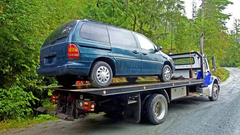Philadelphia flatbed towing a cargo van