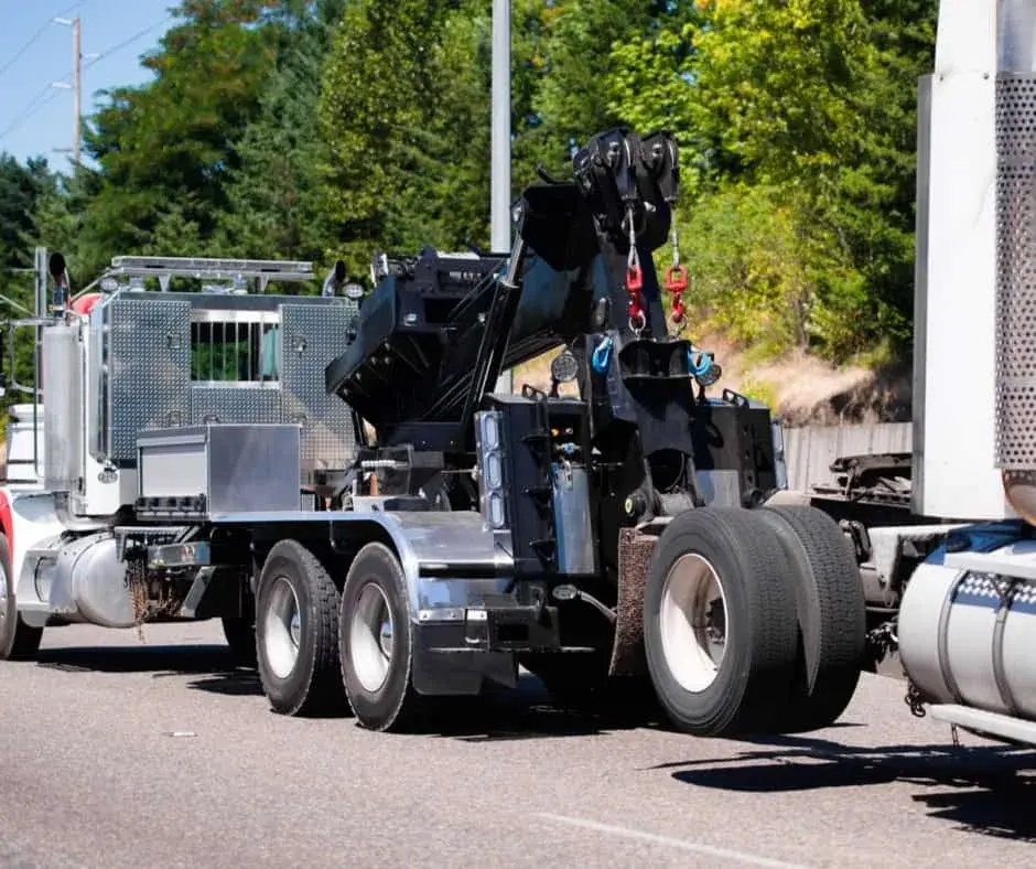 heavy-duty wrecker on a Bensalem highway shoulder